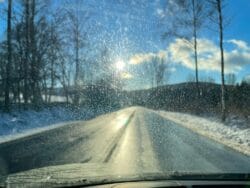 Reflections off a snowy road
